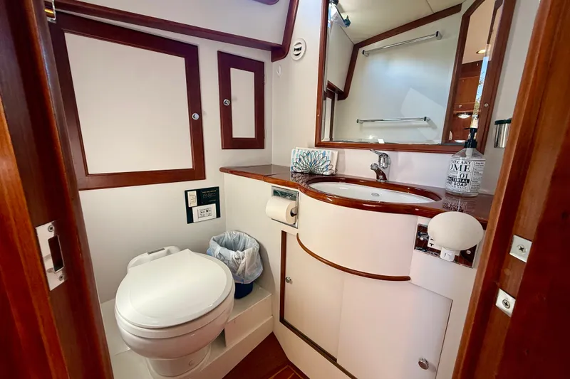 Slide: The Image of 1999 Alden 40 Express yacht bathroom with wooden accents and modern fixtures. - 45