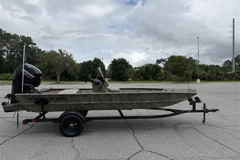 The Image of 2027 Tracker Grizzly 1860 CC boat on trailer in parking lot. - 0