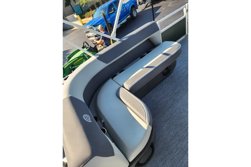 Slide: The Image of 2027 Sun Tracker Bass Buggy 18 DLX pontoon boat with comfortable seating and modern design. - 16