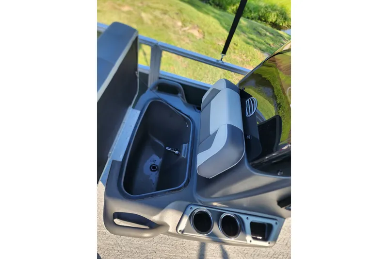 Slide: The Image of Interior view of 2027 Sun Tracker Bass Buggy 18 DLX boat with storage compartment. - 15
