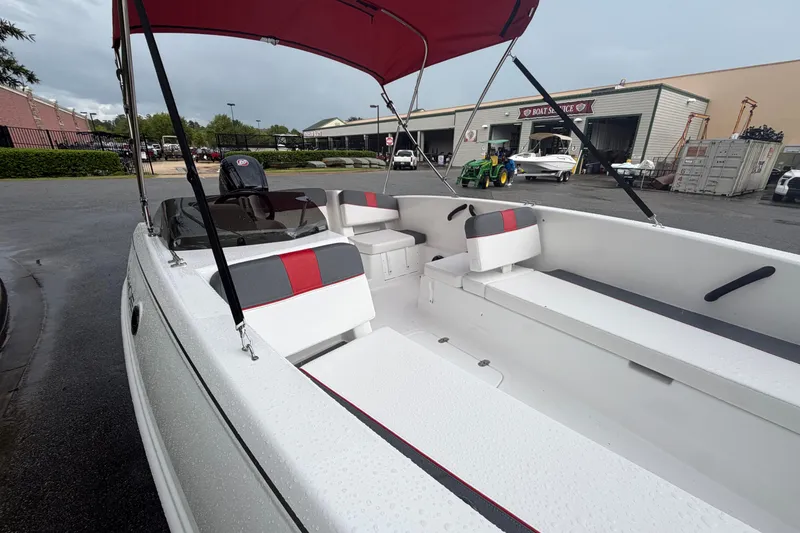 Slide: The Image of 2027 Tahoe T18 boat with red canopy, white interior, and modern seating. - 8