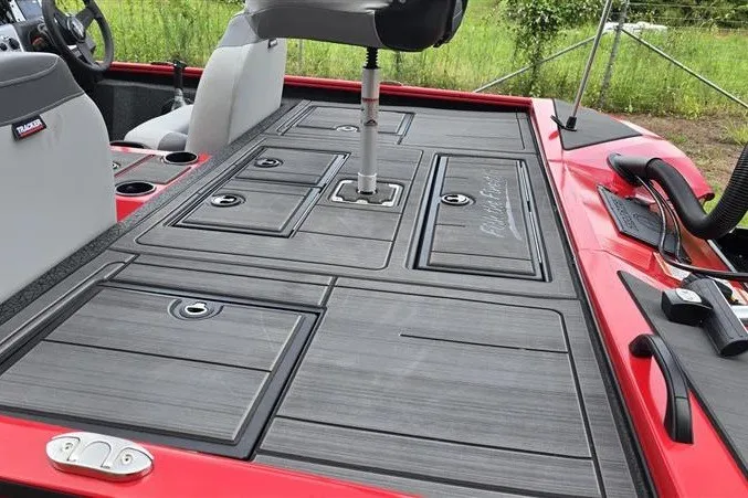 Slide: The Image of Red Tracker Savage 215 boat deck with storage compartments and seating, 2027 model. - 13