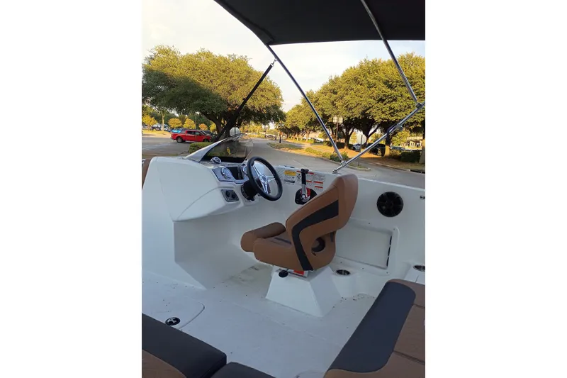 Slide: The Image of Interior of a 2027 Tahoe 1950 boat with steering wheel and seating. - 6