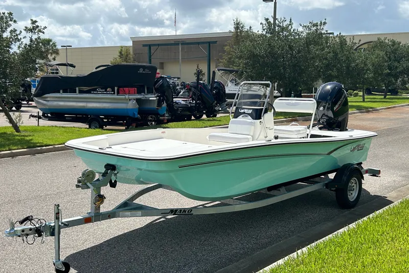 Slide: The Image of 2027 Mako Pro Skiff 17 CC boat on trailer, parked outdoors. - 3
