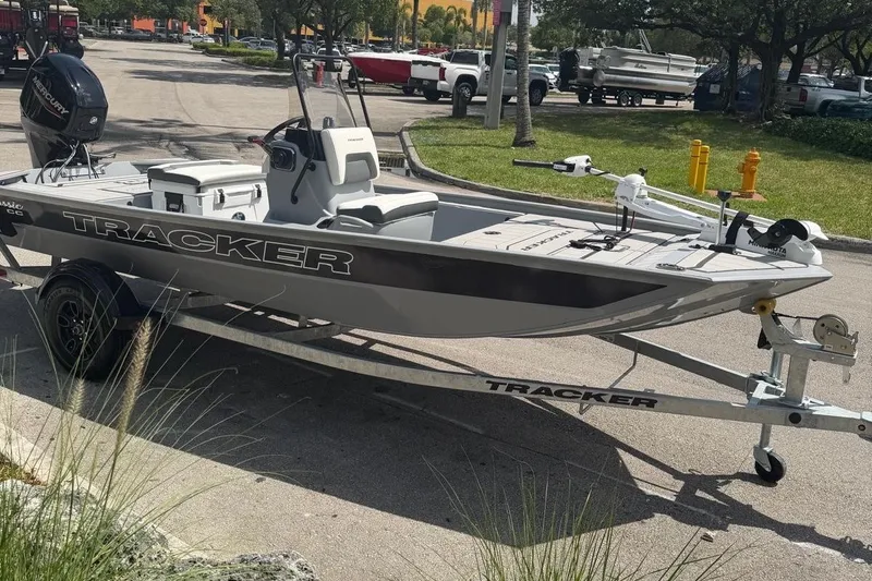 The Image of 2027 Tracker Bass Tracker Classic CC boat on trailer in parking lot. - 0