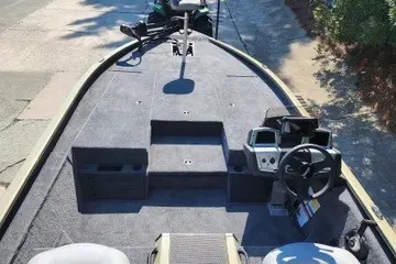 Slide: The Image of 2027 Tracker Savage 215 boat interior with steering console and seating. - 51