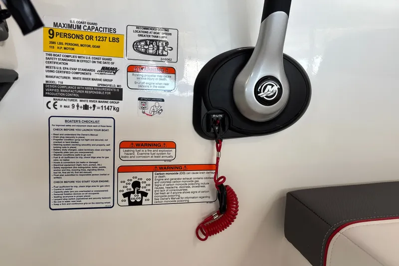 Slide: The Image of Control panel of 2027 Tahoe T18 boat with safety warnings and capacity details. - 18