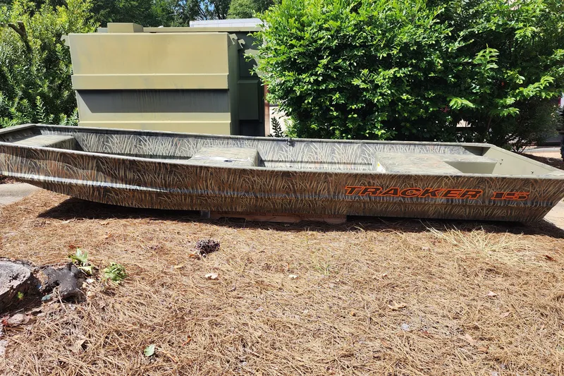 The Image of 2027 Tracker Grizzly 15 Jon boat in a natural outdoor setting. - 0