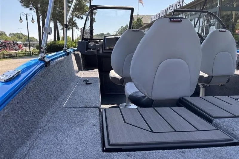 Slide: The Image of 2027 Tracker Pro Guide V-175 Combo boat interior with seating and dashboard view. - 14