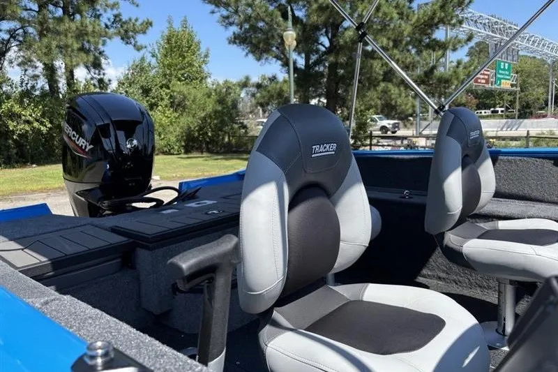 Slide: The Image of 2027 Tracker Pro Guide V-175 Combo boat interior with seats and Mercury engine. - 13