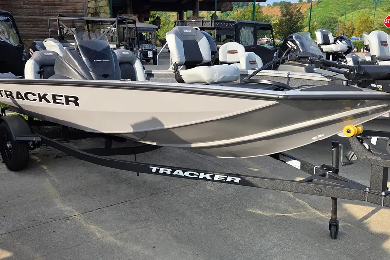 The Image of 2027 Tracker Pro Team 175 boat on trailer, displayed outdoors. - 0