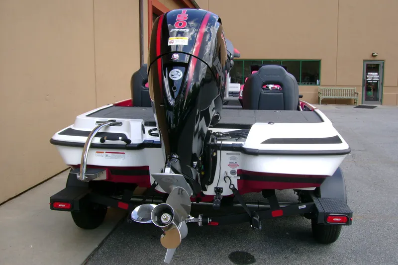 Slide: The Image of 2027 Nitro Z18 XL Pro boat with powerful outboard motor, parked on trailer. - 7
