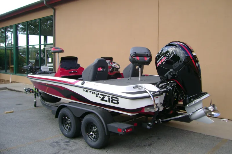 Slide: The Image of 2027 Nitro Z18 XL Pro boat with powerful engine, parked on trailer. - 4