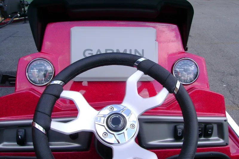 Slide: The Image of Steering wheel and dashboard of 2027 Nitro Z18 XL Pro boat with Garmin display. - 12