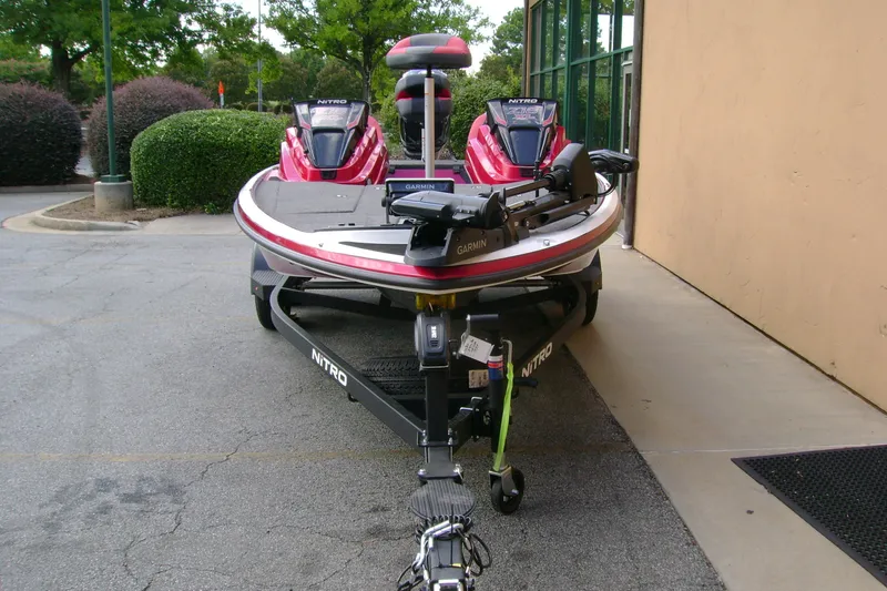 Slide: The Image of 2027 Nitro Z18 XL Pro boat on trailer, parked outdoors near building. - 6