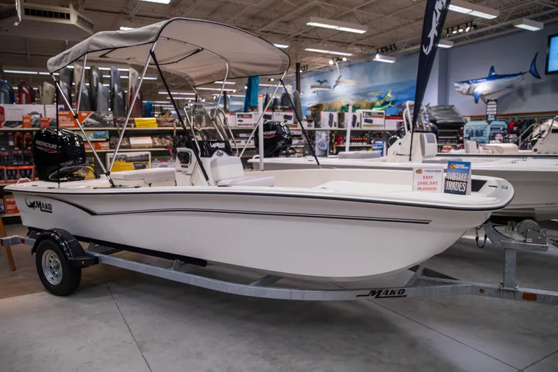 The Image of 2027 Mako Pro Skiff 17 CC boat displayed indoors on a trailer. - 0