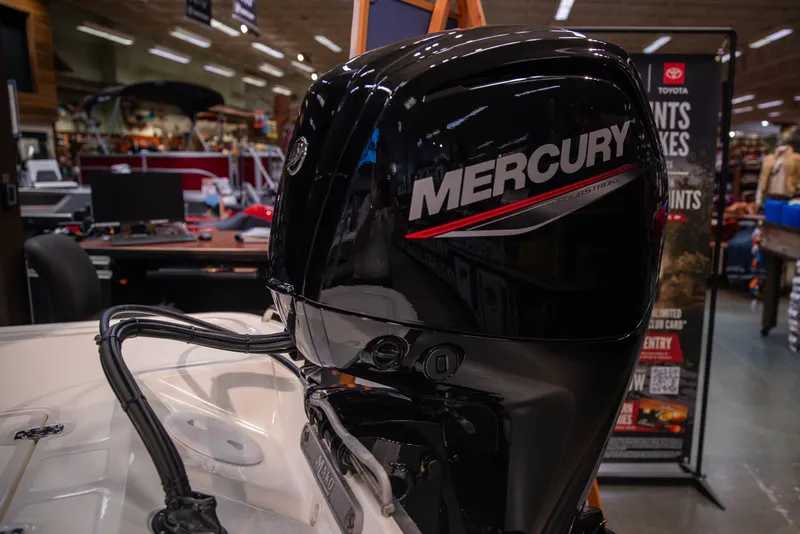 Slide: The Image of 2027 Mako Pro Skiff 17 CC with Mercury outboard motor in showroom display. - 6