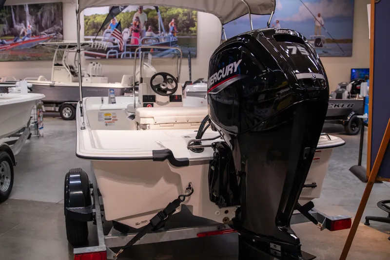 Slide: The Image of 2027 Mako Pro Skiff 17 CC with Mercury 75 engine displayed in showroom. - 5
