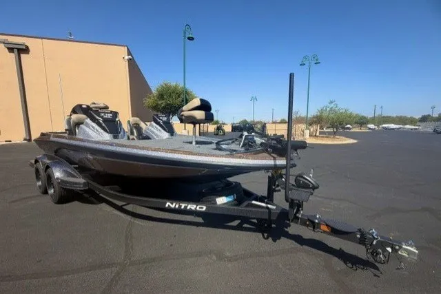 Slide: The Image of 2027 Nitro Z19 XL Pro boat on trailer in parking lot. - 1
