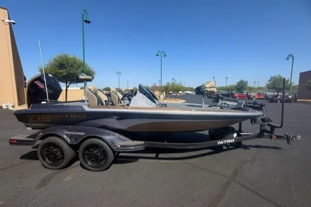 The Image of 2027 Nitro Z19 XL Pro boat on trailer in parking lot. - 0
