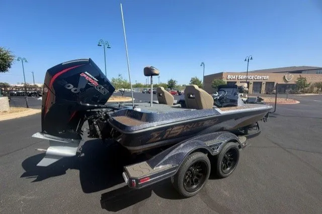 Slide: The Image of 2027 Nitro Z19 XL Pro boat on trailer at service center parking lot. - 2