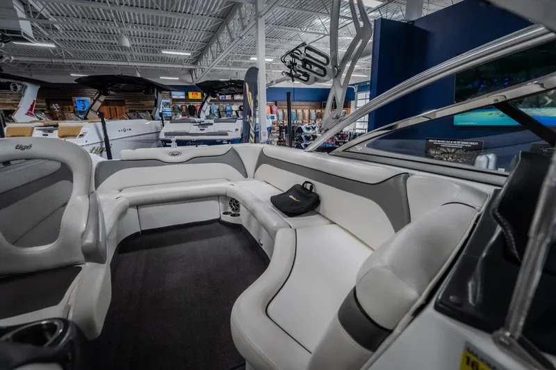 Slide: The Image of 2008 Tigé 24Ve boat interior with white seating in showroom. - 20