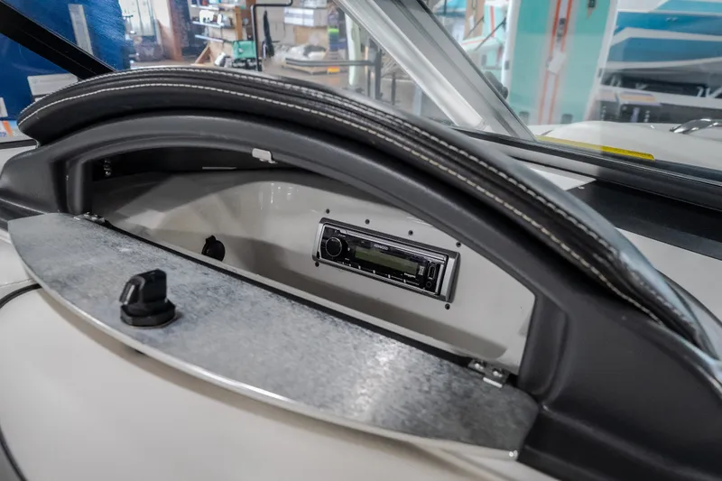 Slide: The Image of 2008 Tigé 24Ve boat dashboard with stereo system and storage compartment. - 17