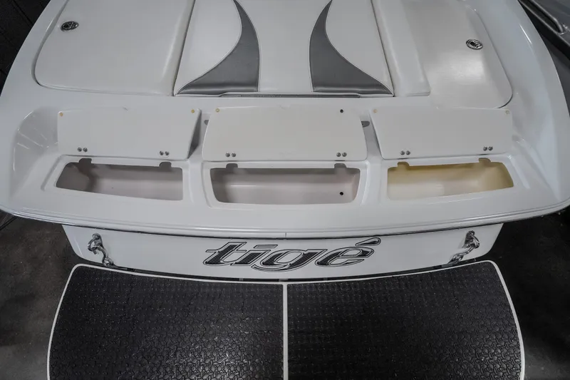 Slide: The Image of 2008 Tigé 24Ve boat stern with storage compartments and logo. - 25