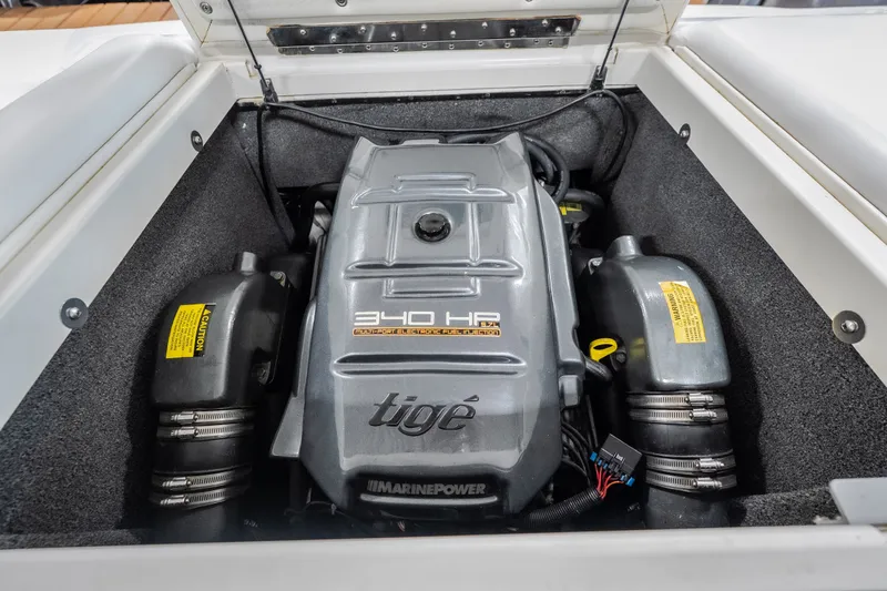 Slide: The Image of 2008 Tigé 24Ve boat engine compartment showcasing 340 HP Marine Power engine. - 23