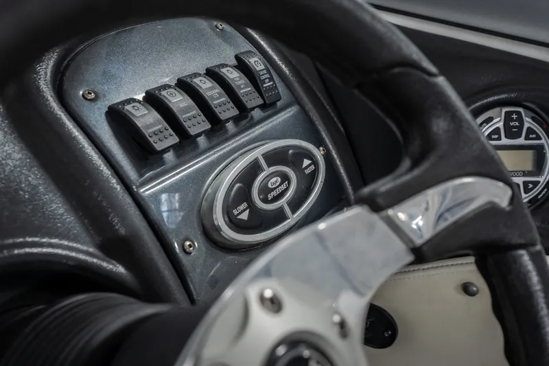Slide: The Image of Dashboard of a 2008 Tigé 24Ve boat with control switches and steering wheel. - 15