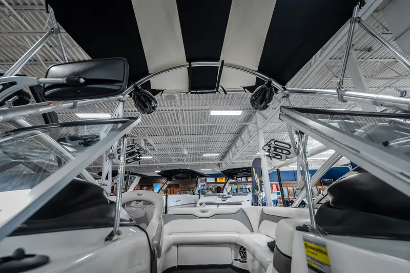 Slide: The Image of Interior view of a 2008 Tigé 24Ve boat with sleek seating and canopy. - 19