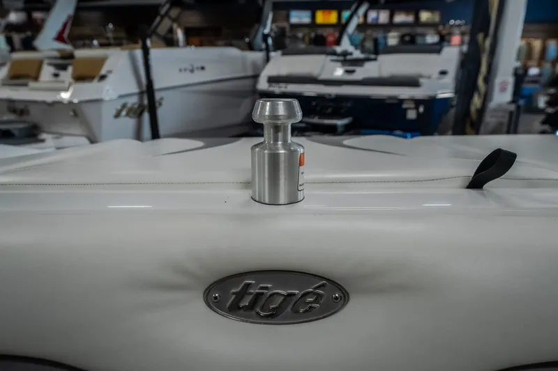 Slide: The Image of 2008 Tigé 24Ve boat interior with logo and metal fitting in a showroom. - 22