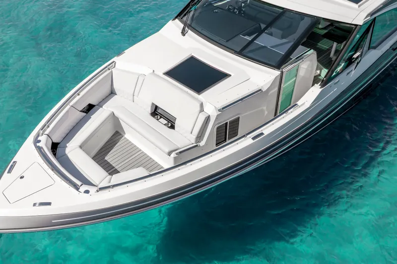 Slide: The Image of 2022 Formula 500 Super Sport Crossover yacht on clear turquoise water. - 14