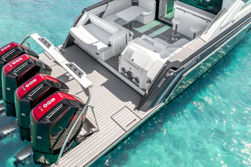 Slide: The Image of 2022 Formula 500 Super Sport Crossover boat with four powerful engines on turquoise water. - 16