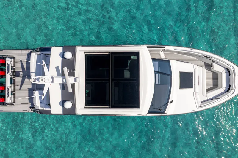 Slide: The Image of Overhead view of 2022 Formula 500 Super Sport Crossover yacht on clear turquoise water. - 7