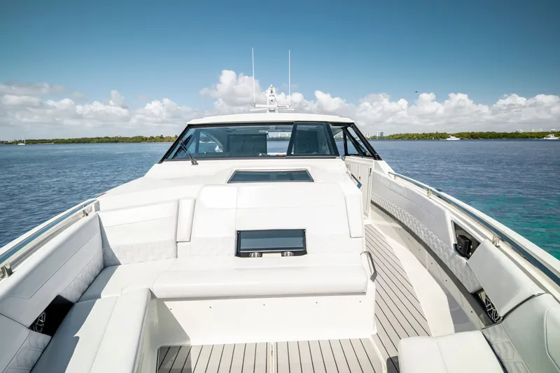 Slide: The Image of 2022 Formula 500 Super Sport Crossover yacht on calm waters under a clear sky. - 30