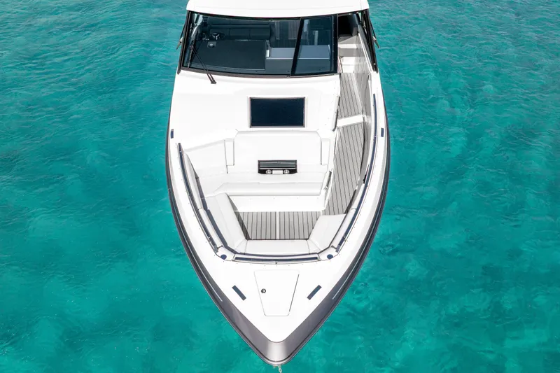 Slide: The Image of 2022 Formula 500 Super Sport Crossover on clear turquoise water. - 13