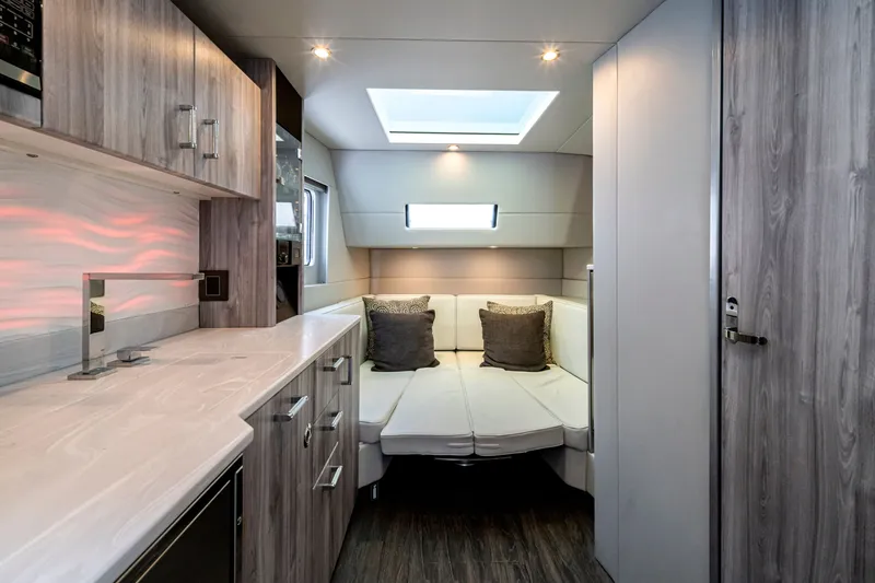 Slide: The Image of 2022 Formula 500 Super Sport Crossover interior with modern kitchen and cozy seating area. - 53