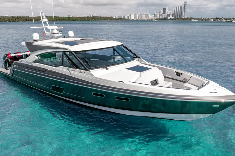 Slide: The Image of 2022 Formula 500 Super Sport Crossover yacht on clear blue water, city skyline in background. - 5