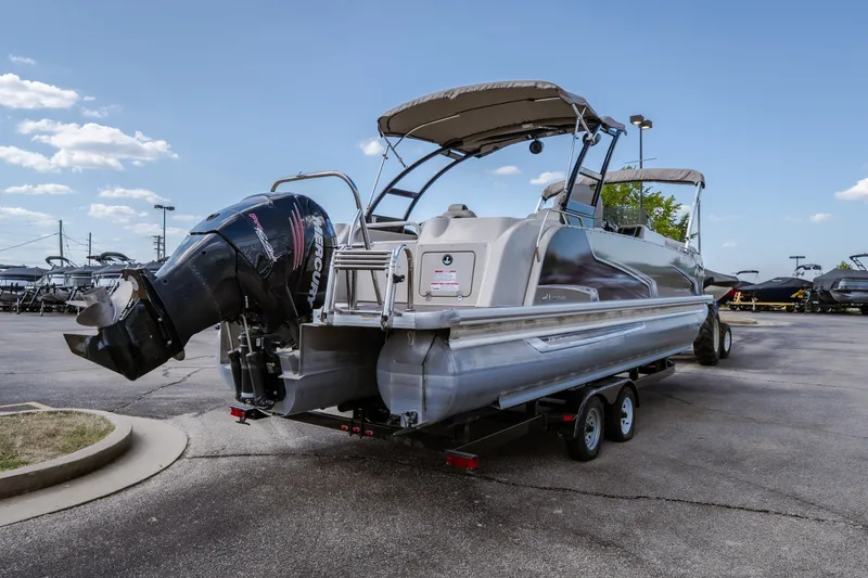 Slide: The Image of 2017 Princecraft Vogue 25 XT pontoon boat on trailer, featuring Mercury outboard motor. - 6