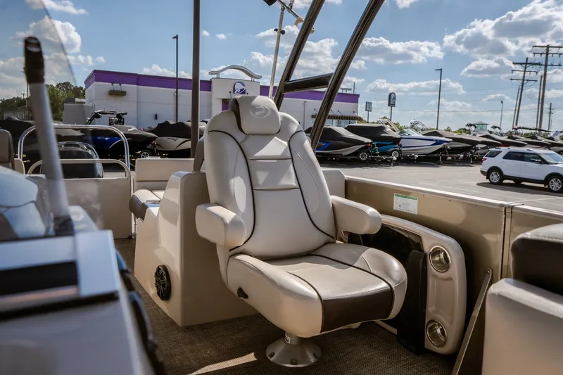Slide: The Image of 2017 Princecraft Vogue 25 XT boat interior with luxurious seating at a dealership. - 24