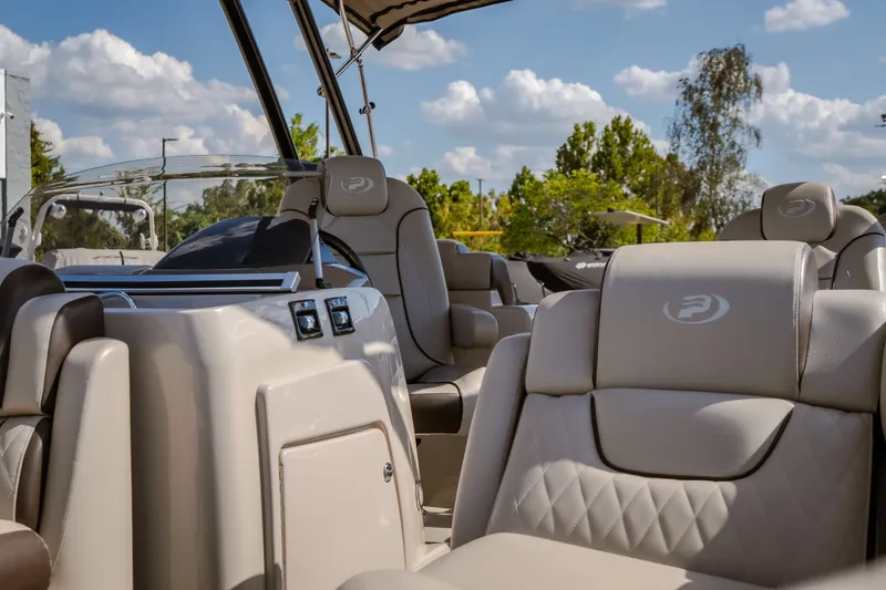 Slide: The Image of Luxurious interior of 2017 Princecraft Vogue 25 XT pontoon boat under a sunny sky. - 21