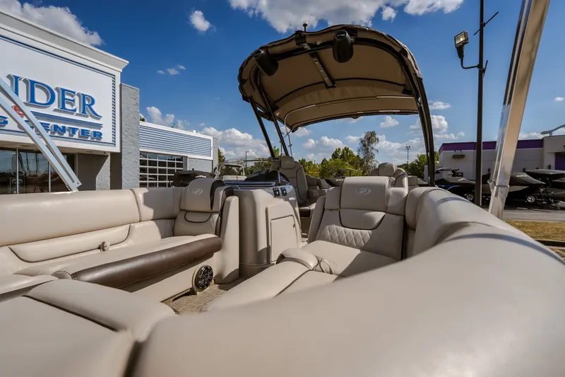 Slide: The Image of 2017 Princecraft Vogue 25 XT pontoon boat with luxurious seating at a dealership. - 20