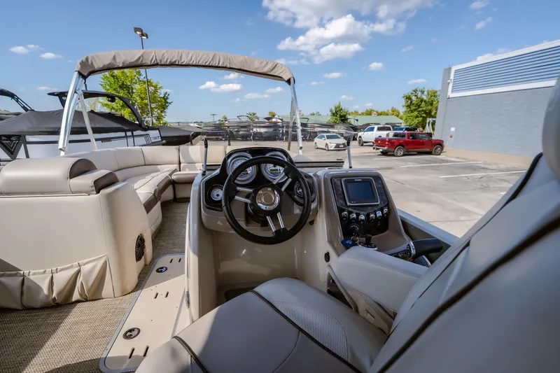 Slide: The Image of 2017 Princecraft Vogue 25 XT boat interior with steering wheel and seating. - 28