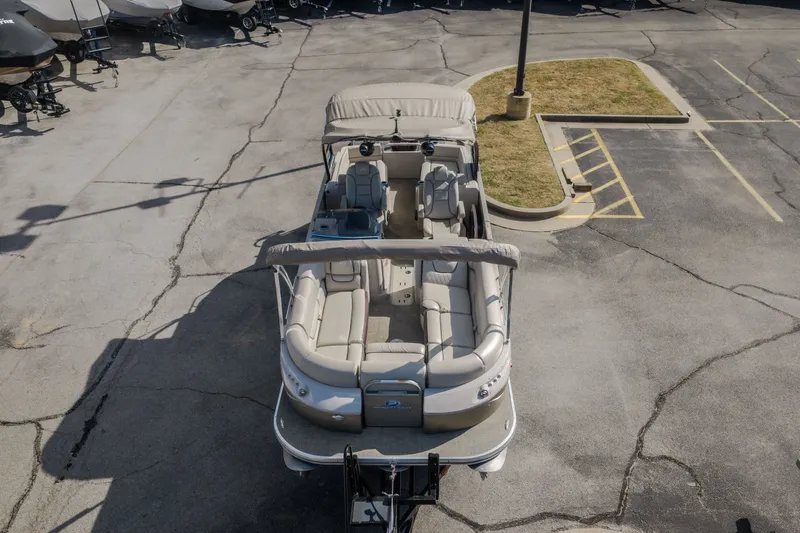 Slide: The Image of 2017 Princecraft Vogue 25 XT pontoon boat in a parking lot, aerial view. - 13