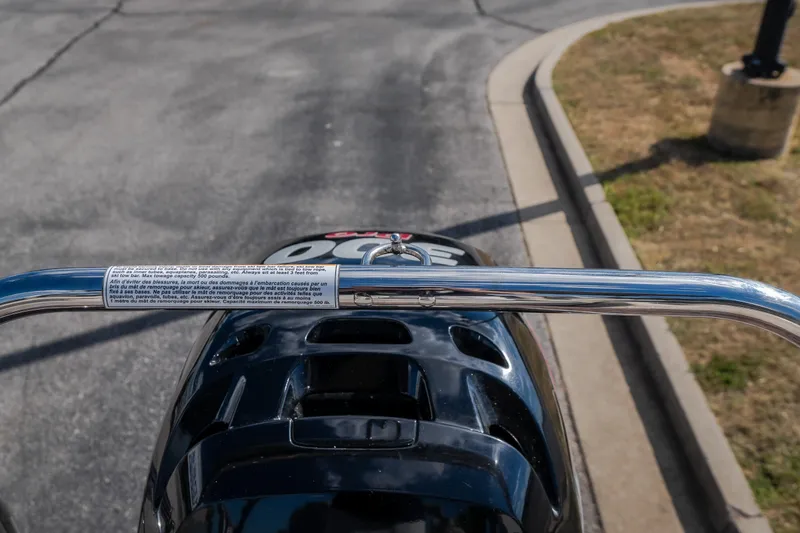 Slide: The Image of Close-up of a 2017 Princecraft Vogue 25 XT boat's rear handle and engine. - 34