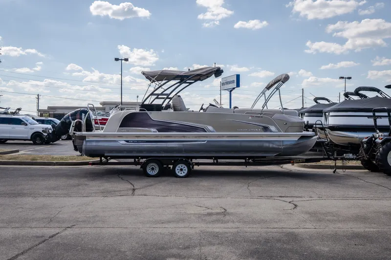Slide: The Image of 2017 Princecraft Vogue 25 XT pontoon boat on trailer, parked outdoors under a cloudy sky. - 5