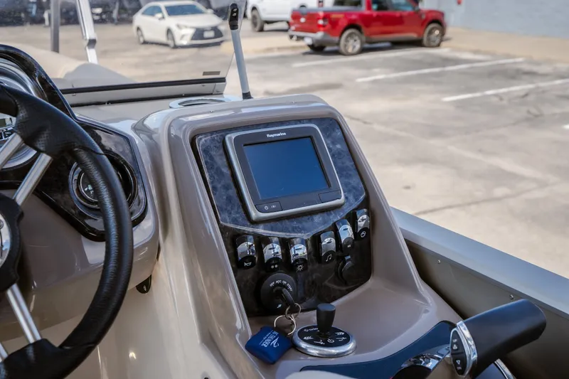 Slide: The Image of 2017 Princecraft Vogue 25 XT dashboard with steering wheel and control panel. - 29