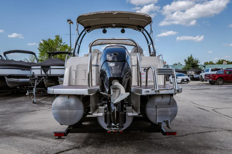Slide: The Image of 2017 Princecraft Vogue 25 XT pontoon boat, rear view, parked outdoors under a clear sky. - 8