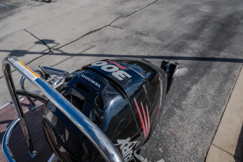 Slide: The Image of Outboard motor on 2017 Princecraft Vogue 25 XT boat, parked on pavement. - 35